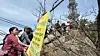 People queing in line to take a photo with Mount Gwanak's summit marker. [WOO JI-WON]