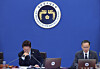President Lee Jae Myung, left, listens to First Vice Finance Minister Lee Hyoung-il talk during a cabinet meeting on May 20. [YONHAP]