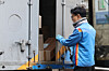 A delivery worker prepares to move parcels on a street in Seoul on March 9, 2026. [NEWS1]