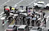 People cross the street with umbrellas near Gwanghwamun Station in Jongno District, central Seoul, on May 20. [YONHAP]