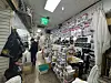 Officials from Korea’s Ministry of Intellectual Property (MOIP), formerly the Korean Intellectual Property Office, conduct a crackdown on an illegal K-pop merchandise seller in Seoul in 2025. [MOIP]