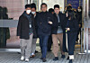 The head of Saekdongwon, a residential facility for people with developmental disabilities in Ganghwa, Incheon, center, is seen at Seoul Central District Court in Seocho District, southern Seoul, to attend a pretrial detention hearing on Feb. 19. [YONHAP]
