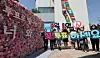 Supporters of multicultural voting participation and representatives from the Gyeonggi provincial election commission hold a campaign encouraging voter participation in the eighth nationwide local elections in front of the foreign residents support headquarters in Danwon District in Ansan, Gyeonggi, on May 15, 2022. [Yonhap]