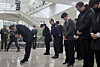 Sohn Ju-hwan, CEO of Anjun Industrial, left, and other executives of the company pay respects to the dead who were found inside an Anjun Industrial auto parts manufacturing factory after a fire broke out on March 20, at Daejeon City Hall on March 22. [NEWS1]