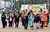 Children and adults traverse a crosswalk in Gangwon on March 11. [YONHAP]