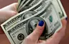 Dollar bills [REUTERS/YONHAP]