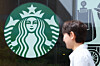 A person walks in front of a Starbucks store in Seoul on June 1. [NEWS1]
