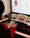 A fan of boy band BTS sits in front of a screen, as ticketing is set to open for BTS’s first concerts in Korea in years as part of the world tour, at an internet cafe in Seoul on Jan. 22. Image is unrelated to the story. [REUTERS/YONHAP]