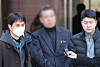 The director of Saekdongwon, center, is seen at Seoul Central District Court in Seocho District, southern Seoul, on Feb. 19 to attend a pretrial detention hearing. Saekdongwon is a residential facility for people with developmental disabilities in Incheon. [YONHAP]