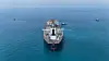 Drone view of oil tanker Helga berthed at one of Iraq's southern offshore oil terminals near Basra as it prepares to load crude oil, becoming the second vessel to arrive since the closure of the Strait of Hormuz, April 24. [REUTERS/YONHAP]