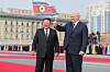 North Korean leader Kim Jong-un, left, and Belarusian President Alexander Lukashenko attend a welcoming ceremony for the Belarusian leader's visit to Pyongyang at Kim Il Sung Square on March 25, as seen in a photo carried by North Korea's official Rodong Sinmun the following day. [NEWS1]