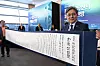 hanjiHuh Min, administrator of Korea Heritage Service, right, poses with the 'KGA Korea Declaration' printed on hanji (Korean traditional paper) at Bexco, Busan on May 27. [KOREA HERITAGE SERVICE]
