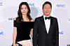 SK Group Chairman Chey Tae-won, right, and his partner Kim Hee-young attend a gala dinner hosted by the Louis Vuitton Foundation in Paris in November 2023. [JOONGANG ILBO]