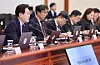 President Lee Jae Myung, left, speaks at a meeting of senior presidential aides held at the Blue House in central Seoul on May 28. [JOINT PRESS CORPS]