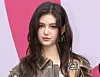 Danielle of the girl group NewsJeans poses on a red carpet on Feb. 1, 2024. [YONHAP]