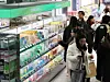 Consumers shop inside a cosmetics and drug store in Seoul. [YONHAP]