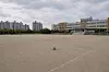 An AI-generated image shows an empty school football field. [JOONGANG ILBO]