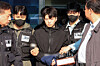 Jang Yun-gi, accused of fatally stabbing a female high school student in central Gwangju, appears before reporters at the Gwangju Seobu Police Station on May 14. [YONHAP]