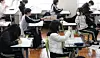 High school students take an exam at a school in Busan on March 24. [YONHAP]
