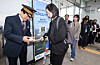 Unification Minister Chung Dong-young, left, checks a passenger's rail ticket while dressed in a train conductor's uniform during an event in Seoul to mark the opening of tourist rail service to Dorasan Station near the inter-Korean border on April 10. [NEWS1]