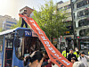 An activist climbs on top of a bus and shows a banner during a demonstration by Solidarity Against Disability Discrimination in central Seoul on April 21. [YONHAP]