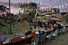 Palestinians gather amid the rubble of destroyed buildings as they gather for their fast-breaking meal during the Muslim holy month of Ramadan, in Khan Younis, Gaza Strip, Feb. 19. [AP/YONHAP]