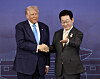 Korean President Lee Jae Myung, right, gestures to U.S. President Donald Trump to take a seat ahead of their talks at the Gyeongju National Museum in Gyeongju, North Gyeongsang, on Oct. 29, 2025. [YONHAP]