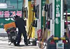 On March 10, a motorist refuels at a gas station in Seongbuk District, Seoul, as fuel prices surge close to 2,000 won per liter amid tensions in the Middle East, prompting the government to introduce a price ceiling on petroleum products. [NEWS1]