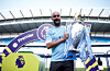 Manchester City manager Pep Guardiola celebrates with the trophy after winning the Premier League title at the Etihad Stadium in Manchester, Britain, on May 6, 2018. [REUTERS/YONHAP]