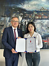 Czech Ambassador Ivan Jančárek. left, and Moon Mi-seon, a 21-year-old student at Kyung Hee University, pose for a photo with a certificate of participation during the 'A Day with Ambassador' diploma ceremony in Seoul on May 13. [EMBASSY OF THE CZECH REPUBLIC TO KOREA]