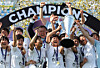 Naegohyang Women's FC captain Kim Kyong-yong holds the championship trophy on the podium with teammates after the club's victory over Tokyo Verdy Beleza in the AFC Women's Champions League final at Suwon Sports Complex on May 23. [YONHAP]