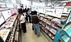 Customers shop for cosmetic products at Musinsa Megastore Seongsu in eastern Seoul on April 24. [KIM JONG-HO]