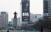 A billboard displays an advertisement for BTS’s comeback live performance at Gwanghwamun Square in Jongno District, central Seoul, on March 11. [NEWS1]