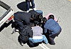 Law enforcement officers arrest on May 5 a suspect who allegedly killed a high schooler in Gwangju [YONHAP]