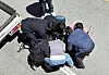 Law enforcement officers arrest on May 5 a suspect who allegedly killed a high schooler in Gwangju [YONHAP]