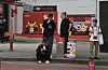 People smoke around an ashtray bin in Hongdae in Mapo District, western Seoul, on May 2. [SHIN MIN-HEE]