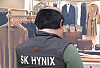 A screenshot from the Coupang Play series ″SNL Korea' (2021-) showing a person wearing an SK hynix vest. [SCREEN CAPTURE]