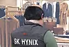 A screenshot from the Coupang Play series ″SNL Korea' (2021-) showing a person wearing an SK hynix vest. [SCREEN CAPTURE]