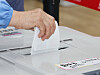 A voter inserts their ballot into the ballot box after making their votes at a voting station in Jeonju, North Jeolla, on May 29, the first day of the 2026 local elections early voting period. [YONHAP]
