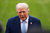 President Donald Trump speaks with reporters before departing on Marine One from the South Lawn of the White House, on March 20, in Washington. [AP/YONHAP]