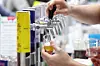 A booth staffer prepares beer samples at the Korea Beer Expo & Drink Seoul at Coex in Gangnam District, Seoul, on April 16. [YONHAP]