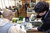 Vernerable Seonjae makes noodles with a staff during a media event held at the Temple Cuisine Culture Experience Center in Jongno District, central Seoul, on Feb. 26 [CULTURAL CORPS OF KOREAN BUDDHISM]