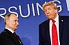 U.S. President Donald Trump looks on next to Russian President Vladimir Putin during a press conference following their meeting to negotiate an end to the war in Ukraine, at Joint Base Elmendorf-Richardson, in Anchorage, Alaska, on Aug. 15, 2025. [REUTERS/YONHAP]