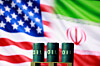 U.S. and Iranian flags are seen behind oil barrels in this illustration created on March 23. [REUTERS/YONHAP]