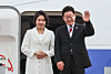 President Lee Jae Myung, right, and first lady Kim Hea Kyung wave as they depart for state visits to Singapore and the Philippines from Seoul Air Base in Seongnam, Gyeonggi on March 1. [NEWS1]
