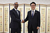 Prime Minister Kim Min-seok, right, poses for a photo with Michael Harris, vice chief of the New York Stock Exchange, during their meeting at the government complex in Seoul on March 23, 2026, in this photo released by Kim's office. [YONHAP]