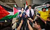 Activists Kim Ah-hyun, left, and Kim Dong-hyeon speak to reporters after their arrival at Incheon International Airport on May 22. [NEWS1]
