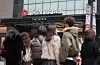 People walk past the Shinsegae department store main branch in central Seoul.
