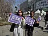Fans pose with the BTS special edition of the Korea JoongAng Daily in central Seoul on March 21. [KIM MIN-YOUNG]