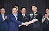 Labor Minister Kim Young-hoon, center, Samsung Electronics' management negotiator Yeo Myung-koo, left center, and Choi Seung-ho, right center, head of the Samsung Electronics chapter of the Samsung Group United Union, shake hands after signing a tentative wage agreement. [YONHAP]